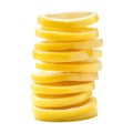 A tall stack of bright yellow lemon slices artfully arranged and isolated on white background Royalty Free Stock Photo