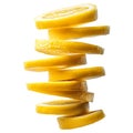 A tall stack of bright yellow lemon slices artfully arranged isolated on white background Royalty Free Stock Photo