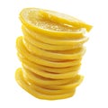 A tall stack of bright yellow lemon slices artfully arranged isolated on white background Royalty Free Stock Photo