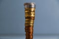 A tall stack of coins. Euro coins are piled up, the largest coins are on top of the smaller ones Royalty Free Stock Photo