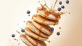 Stack of fluffy pancakes with maple syrup splashing, powdered sugar, and fresh blueberries Royalty Free Stock Photo