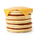 Stack of Six Golden Brown Pancakes Topped with a Slice of Yellow Cheese on White Background Royalty Free Stock Photo
