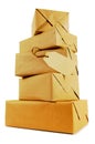 Tall stack of wrapped mail packages isolated on white background