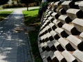 Tall staggered concrete block retaining wall side view Royalty Free Stock Photo