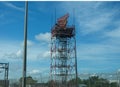 Tall steel airport surveillance tower near an airport