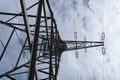 tall steel high voltage pylon mast clouds Royalty Free Stock Photo