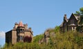 Tall stone gothic houses set in the woodland landscape i hebden bridge west yorkshire with blue sky Royalty Free Stock Photo