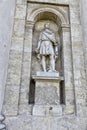 Tall stone statue of the antique style man