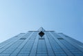 Tall tower blue glass facade building bottom view