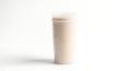 Tall translucent plastic cup filled with creamy beverage on white background Royalty Free Stock Photo