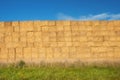A tall wall of stacked haybales Royalty Free Stock Photo
