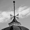 Tall Weather Vane on Top of Cupola
