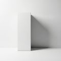 A tall white rectangular object casting a shadow on a plain background Royalty Free Stock Photo