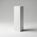 A tall white rectangular prism standing alone against a gray background Royalty Free Stock Photo