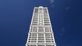 Tall skyscraper under deep blue sky Royalty Free Stock Photo