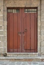 Tall wooden door with metal knob Royalty Free Stock Photo