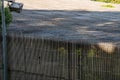 Tall wooden fence enclosure cage at nature reserve outdoors Royalty Free Stock Photo