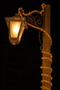 Tall wooden street lamp