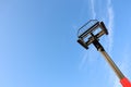 An Elevated Work Platform Stands Out Against a Clear and Expansive Blue Sky Above Royalty Free Stock Photo
