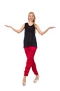 The tall young woman in red pants isolated on white Royalty Free Stock Photo