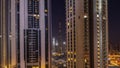 Tallest skyscrapers in downtown dubai located on bouleward street near shopping mall aerial all night timelapse. Royalty Free Stock Photo