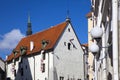 Tallinn, building of the 17th century in the old city and flags with the coats of arms of the ancient cities of the Hanseatic