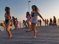 Tallinn, Esntonia - 09.2019: happy young people are dancing at the beach on beautiful summer sunset Royalty Free Stock Photo