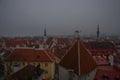 Tallinn, Estonia: Aerial cityscape with Medieval Old Town, Landscape with a panorama of the city in foggy and gloomy weather Royalty Free Stock Photo