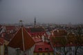 Tallinn, Estonia: Aerial cityscape with Medieval Old Town, Landscape with a panorama of the city in foggy and gloomy weather Royalty Free Stock Photo