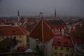 Tallinn, Estonia: Aerial cityscape with Medieval Old Town, Landscape with a panorama of the city in foggy and gloomy weather Royalty Free Stock Photo