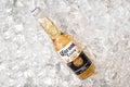 TALLINN, ESTONIA- April 12.2021: Corona beer in glass bottle on ice. Corona Extra is pale lager