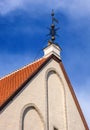 Tallinn, Estonia - architectural details of old town houses - weather vane on the roof of an old house Royalty Free Stock Photo
