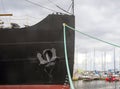 Tallinn, Estonia, August 2018. Ship`s nose, metal anchor and cable for mooring vessels close-up. Royalty Free Stock Photo