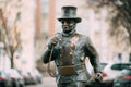 Tallinn, Estonia. Bronze Statue Of A Lucky Happy Chimney Sweep With Some Bronze Footsteps Behind Him