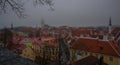 Tallinn, Estonia: Church of St. Olaf. Aerial cityscape with Medieval Old Town, Landscape with a panorama of the city in foggy and Royalty Free Stock Photo