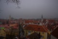 Tallinn, Estonia: Church of St. Olaf. Aerial cityscape with Medieval Old Town, Landscape with a panorama of the city in foggy and Royalty Free Stock Photo