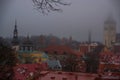 Tallinn, Estonia: Church of St. Olaf. Aerial cityscape with Medieval Old Town, Landscape with a panorama of the city in foggy and Royalty Free Stock Photo