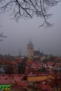 Tallinn, Estonia: Church of St. Olaf. Aerial cityscape with Medieval Old Town, Landscape with a panorama of the city in foggy and Royalty Free Stock Photo