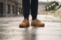 TALLINN, ESTONIA - CIRCA OCTOBER, 2017: teen girl stand in Timberland boots on street