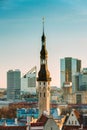 Tallinn, Estonia. View Of Tower Of Tallinn Town Hall On Background Of Modern Architecture. Oldest Town Hall In Baltic
