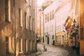 Tallinn, Estonia. Empty Puhavaimu Street In Old Town During Sunset. Motorcycle Parked On Old Street