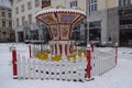 Tallinn, Estonia, Europe - January 3, 2021: Empty children carousel on City Town hall (Raekoja plats) by winter with no