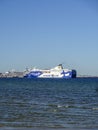 Eckero Line white and blue ferry ship arriving to the port.