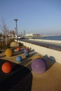 Tallinn, Estonia, Europe - November 2, 2021: Textured multi color stone balls along promenade on Reidi tee street. Ferry