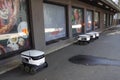 Tallinn, Estonia, Europe - September 26, 2021: Four modern automatic robot Starship for food delivery waiting on parking