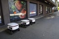 Tallinn, Estonia, Europe - September 26, 2021: Three modern automatic robot Starship for food delivery waiting on