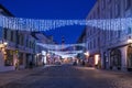 TALLINN, ESTONIA - JANUARY 12, 2018: Night picturesque winter view of the old streets with Christmas decoration in the historical Royalty Free Stock Photo