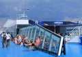 Passengers rest on the upper deck of the Finlandia ferry. View of the bar
