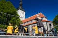 Little boy in a medieval-fashioned dress looks at the knight`s fight in Tallinn