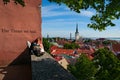 Tallinn, Estonia-June 14, 2016 - Young embracing couple sit on observation deck.